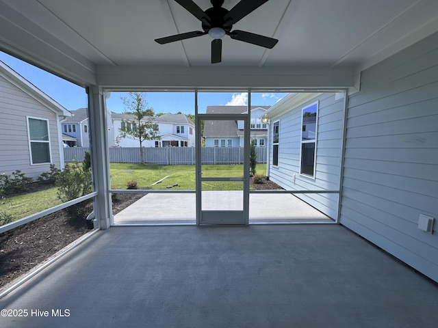 3157 Painted Turtle Loop Unit 37, Wilmington, NC 28409 - unfurnished sunroom featuring ceiling fan and a residential view