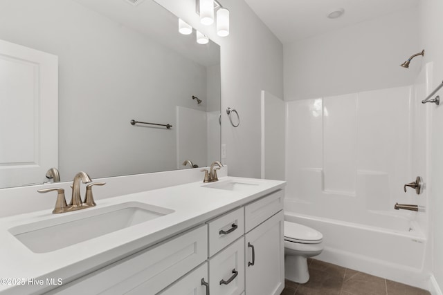 full bathroom featuring toilet, shower / tub combination, a sink, and tile patterned flooring
