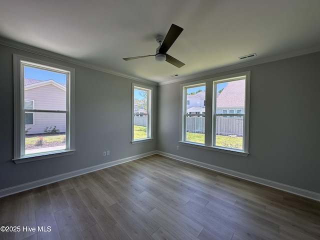 3157 Painted Turtle Loop Unit 37, Wilmington, NC 28409 - empty room with crown molding, a ceiling fan, and dark wood-style flooring