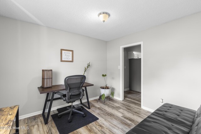 803 Oakwood Ave, Jacksonville, NC 28546 - office with baseboards, a textured ceiling, and wood finished floors