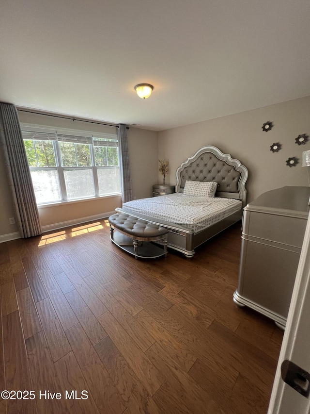 bedroom with wood finished floors