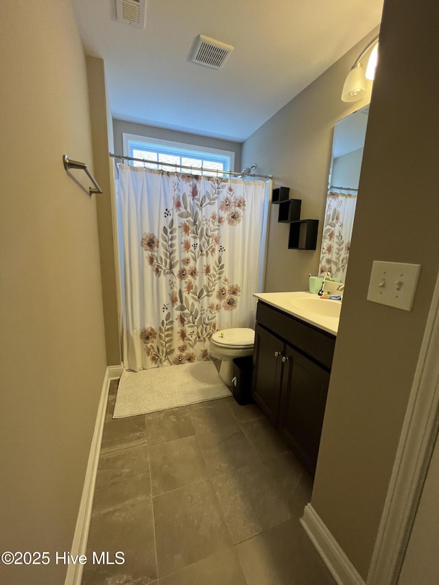 full bath with vanity, baseboards, toilet, and visible vents