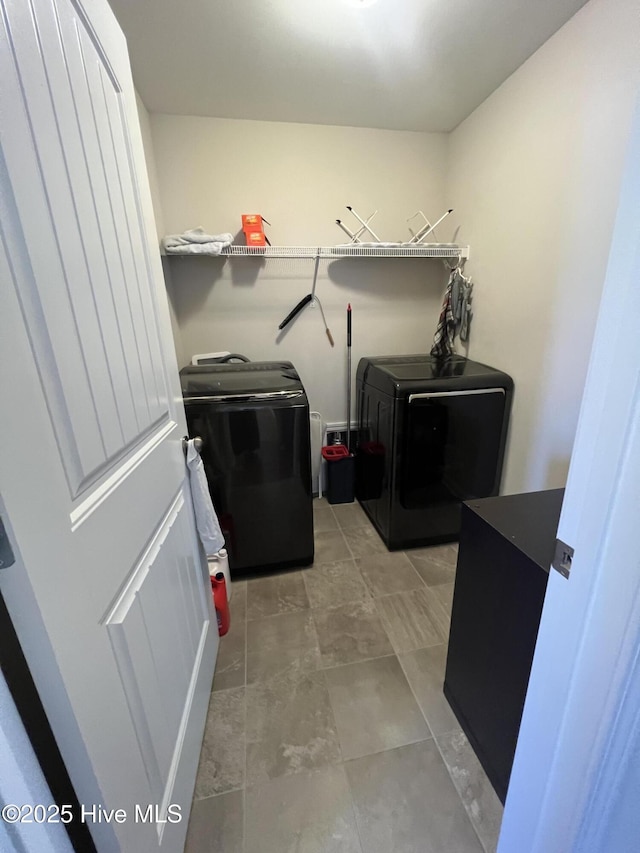 clothes washing area with laundry area and washing machine and dryer
