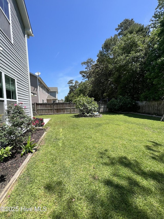 view of yard featuring a fenced backyard