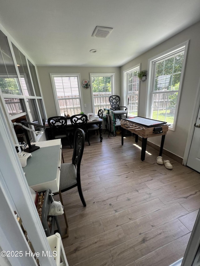 interior space featuring visible vents and wood finished floors