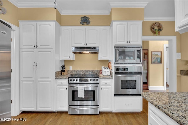 kitchen featuring appliances with stainless steel finishes, under cabinet range hood, light stone countertops, white cabinets, and ornamental molding