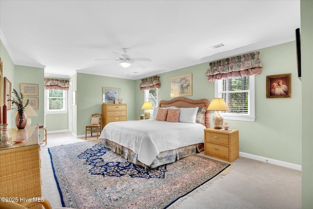 bedroom with crown molding, carpet, baseboards, and ceiling fan