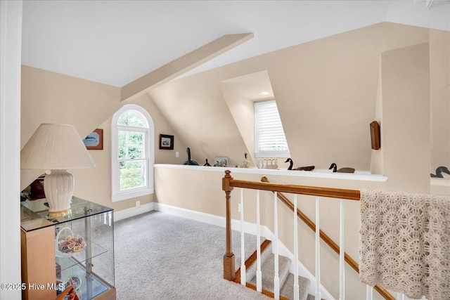 bonus room with vaulted ceiling, carpet flooring, and baseboards