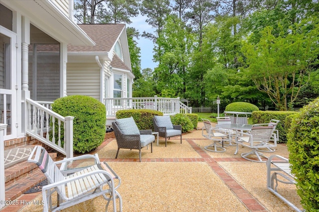 view of patio / terrace featuring view of scattered trees