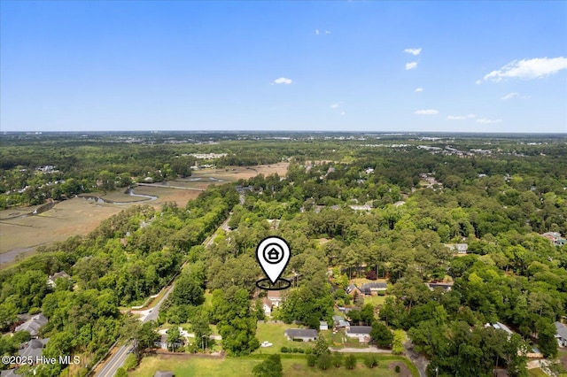 drone / aerial view of a heavily wooded area