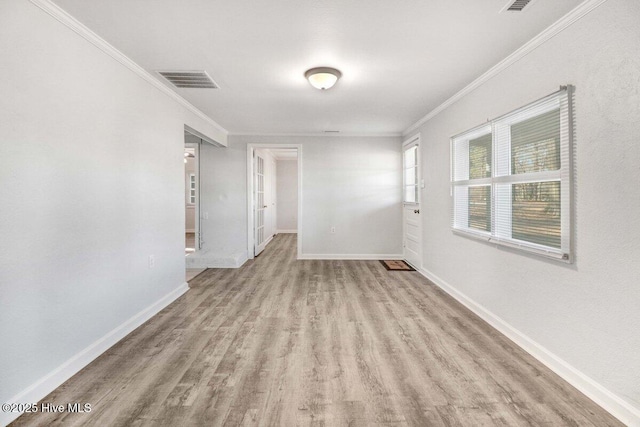 3210 Central Heights Rd, Goldsboro, NC 27534 - spare room featuring baseboards, visible vents, ornamental molding, and wood finished floors