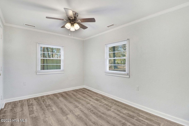 3210 Central Heights Rd, Goldsboro, NC 27534 - empty room with a wealth of natural light, a ceiling fan, wood finished floors, and visible vents