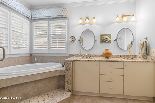 full bathroom featuring a sink, tile patterned floors, crown molding, and a wealth of natural light