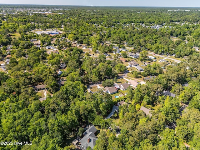 drone / aerial view with a view of trees