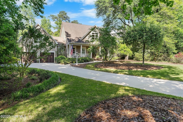 view of front of house with covered porch and a front lawn