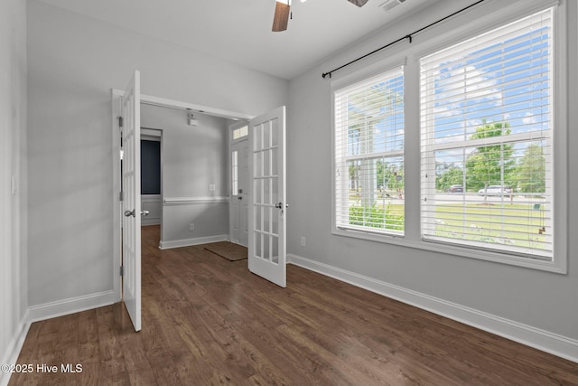 224 Pristine Ct, West End, NC 27376 - unfurnished bedroom featuring baseboards, dark wood-type flooring, french doors, and a ceiling fan