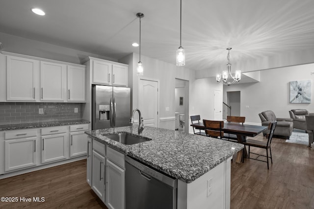 224 Pristine Ct, West End, NC 27376 - kitchen with stainless steel appliances, a sink, dark wood-style flooring, white cabinets, and backsplash