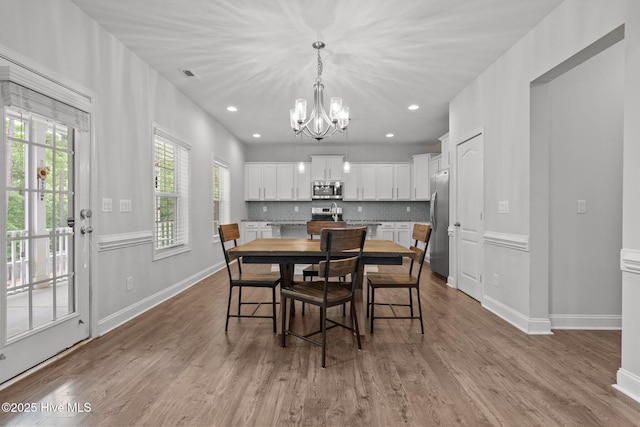 224 Pristine Ct, West End, NC 27376 - dining area with a chandelier, baseboards, wood finished floors, and recessed lighting