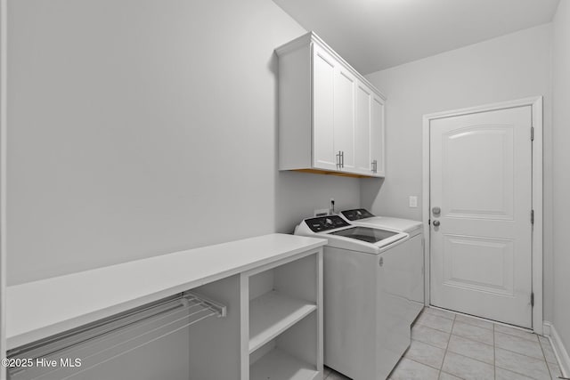 224 Pristine Ct, West End, NC 27376 - washroom featuring cabinet space, washing machine and clothes dryer, and light tile patterned flooring