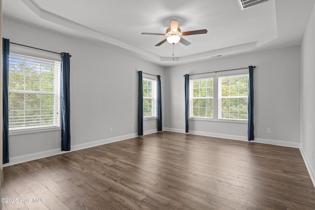 224 Pristine Ct, West End, NC 27376 - spare room with a raised ceiling, ceiling fan, healthy amount of natural light, and wood finished floors