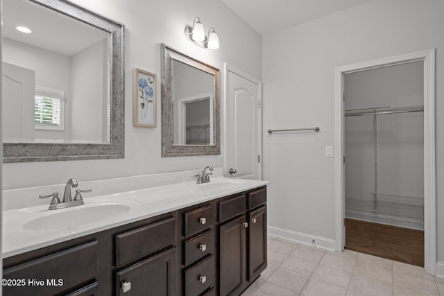 224 Pristine Ct, West End, NC 27376 - full bathroom featuring tile patterned flooring, double vanity, and baseboards