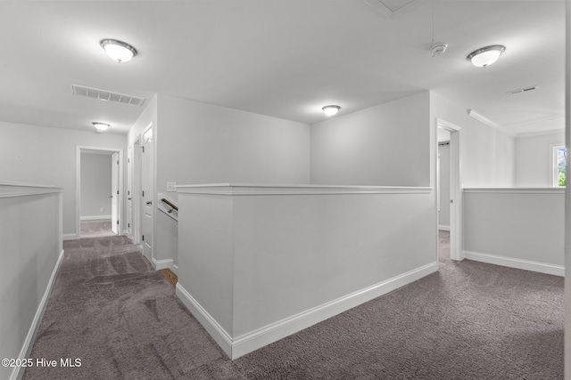 224 Pristine Ct, West End, NC 27376 - hall featuring an upstairs landing, dark carpet, attic access, and baseboards