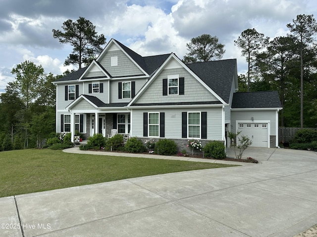 craftsman inspired home with an attached garage, a front lawn, stone siding, concrete driveway, and covered porch