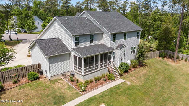 224 Pristine Ct, West End, NC 27376 - rear view of property with roof with shingles and a sunroom