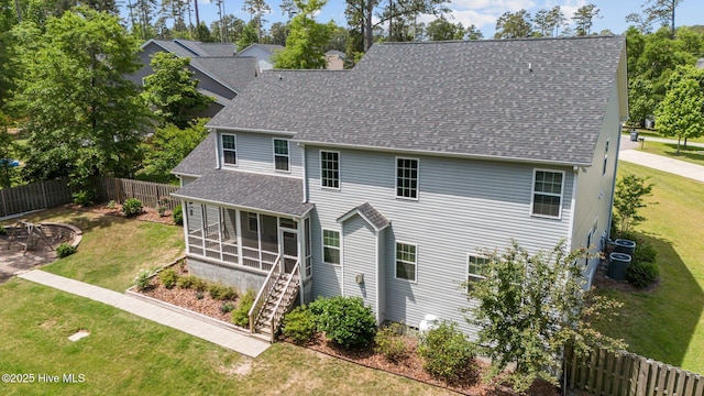 224 Pristine Ct, West End, NC 27376 - back of house with a sunroom, a shingled roof, and stairway