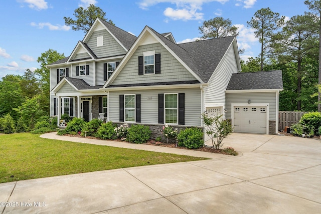 224 Pristine Ct, West End, NC 27376 - craftsman house with an attached garage, driveway, stone siding, and a shingled roof
