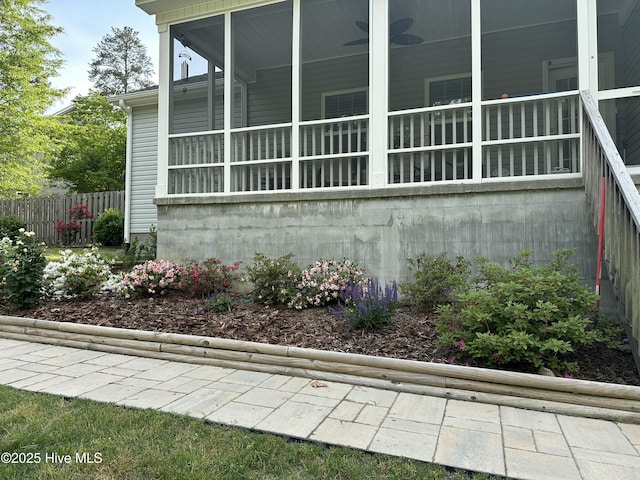 view of side of property featuring fence
