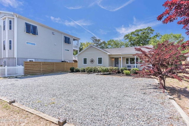 2005 E Oak Island Dr, Oak Island, NC 28465 - exterior space with a porch and fence