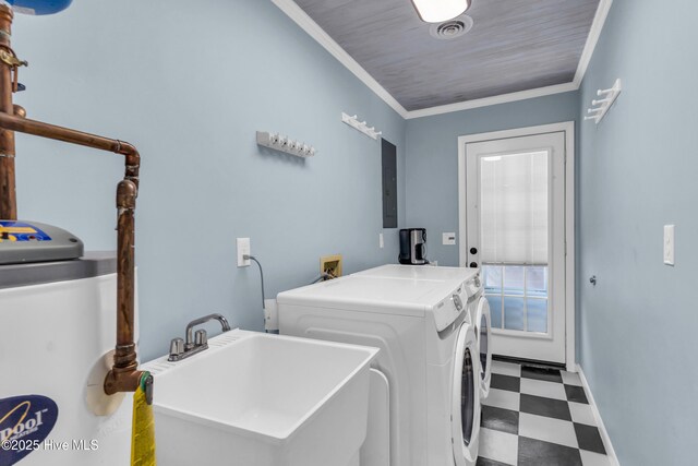 2005 E Oak Island Dr, Oak Island, NC 28465 - clothes washing area featuring laundry area, a sink, tile patterned floors, visible vents, and washing machine and dryer