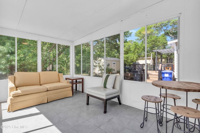 2005 E Oak Island Dr, Oak Island, NC 28465 - sunroom / solarium featuring an outdoor living space