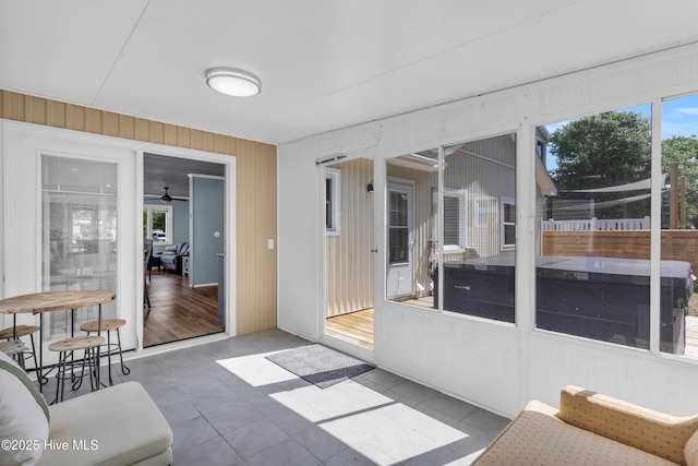 2005 E Oak Island Dr, Oak Island, NC 28465 - sunroom featuring a ceiling fan