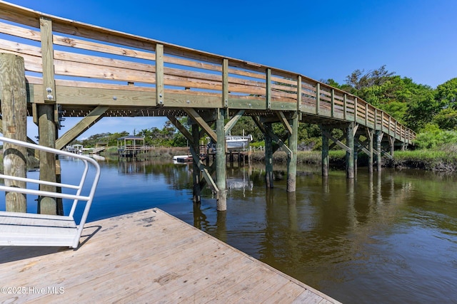 2005 E Oak Island Dr, Oak Island, NC 28465 - dock area featuring a water view and boat lift