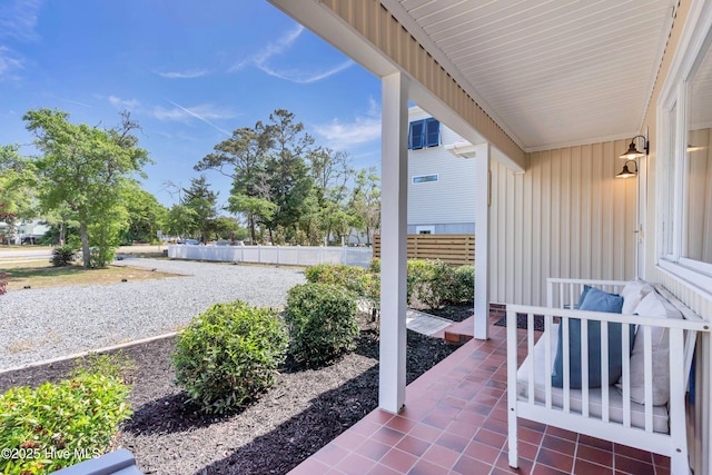 2005 E Oak Island Dr, Oak Island, NC 28465 - view of patio featuring fence