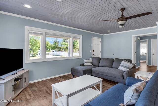 2005 E Oak Island Dr, Oak Island, NC 28465 - living area featuring baseboards, recessed lighting, light wood-type flooring, wood ceiling, and a ceiling fan