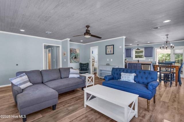 2005 E Oak Island Dr, Oak Island, NC 28465 - living area featuring recessed lighting, ornamental molding, and light wood-style flooring