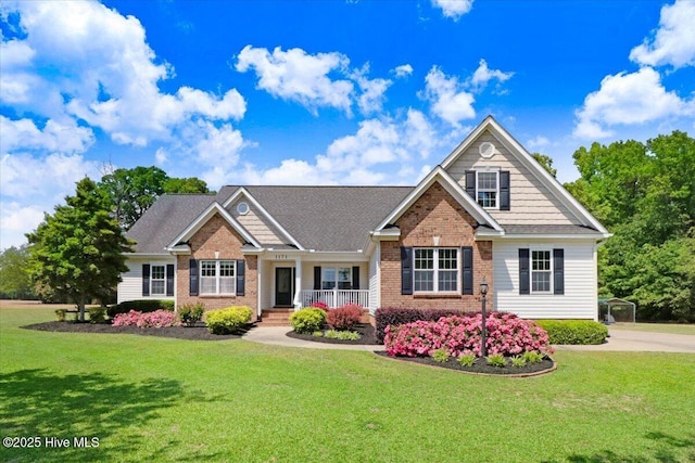 1171 Airport Rd, Pikeville, NC 27863 - craftsman inspired home featuring brick siding, a front lawn, and covered porch