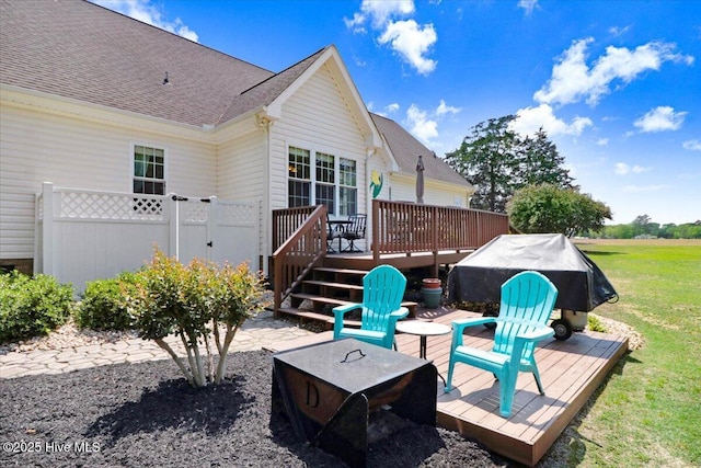 1171 Airport Rd, Pikeville, NC 27863 - rear view of property featuring a shingled roof, a yard, and a deck