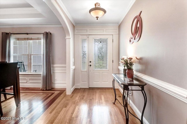 1171 Airport Rd, Pikeville, NC 27863 - entryway with arched walkways, light wood finished floors, and ornamental molding