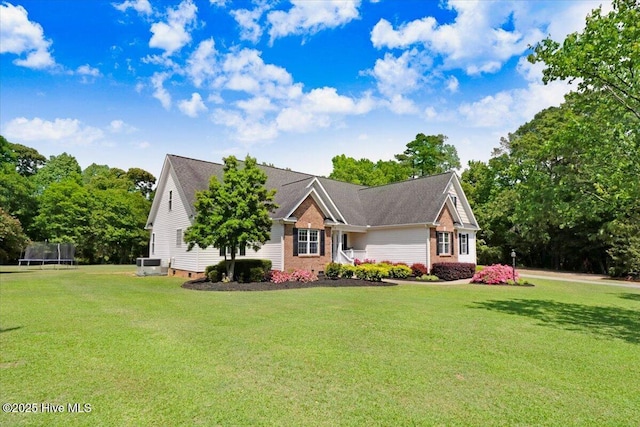 1171 Airport Rd, Pikeville, NC 27863 - single story home featuring a trampoline and a front yard