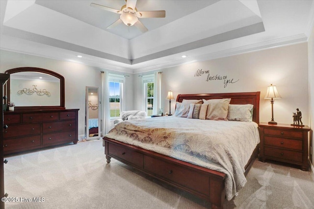1171 Airport Rd, Pikeville, NC 27863 - bedroom with crown molding, light carpet, a tray ceiling, and recessed lighting