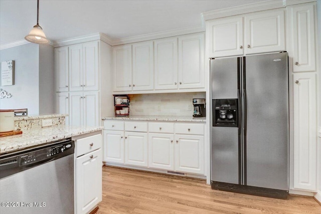 1171 Airport Rd, Pikeville, NC 27863 - kitchen with crown molding, decorative backsplash, white cabinetry, and stainless steel appliances