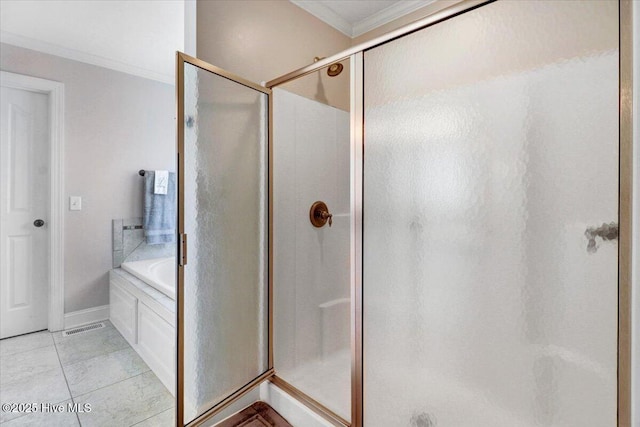 1171 Airport Rd, Pikeville, NC 27863 - bathroom with a bath, crown molding, tile patterned flooring, a shower stall, and baseboards