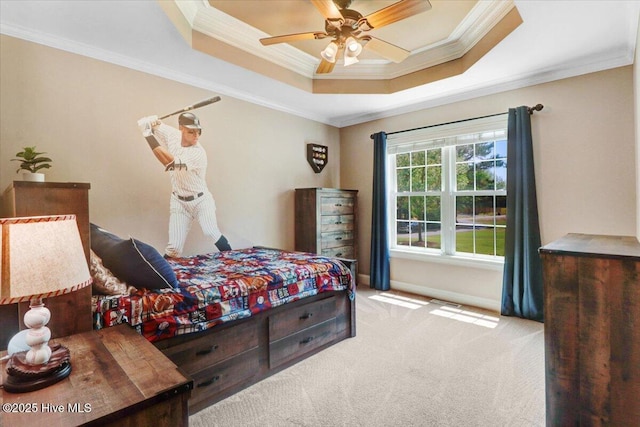 1171 Airport Rd, Pikeville, NC 27863 - carpeted bedroom featuring baseboards, ornamental molding, a tray ceiling, and ceiling fan