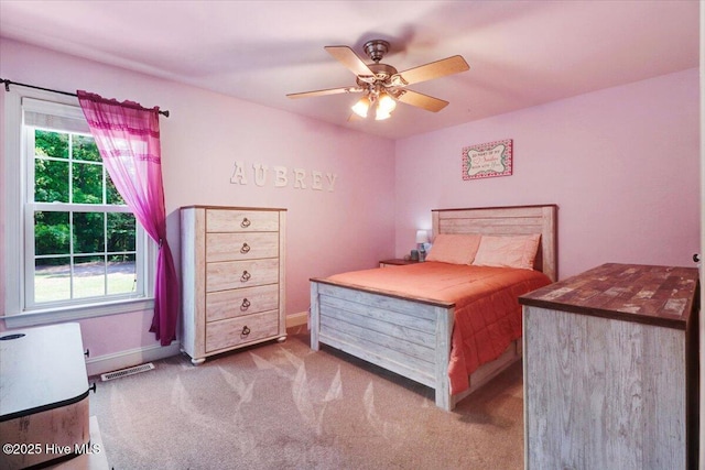 1171 Airport Rd, Pikeville, NC 27863 - bedroom featuring baseboards, a ceiling fan, and carpet flooring