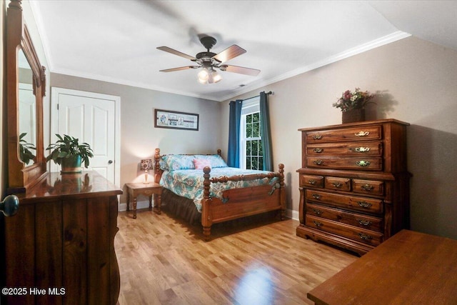 1171 Airport Rd, Pikeville, NC 27863 - bedroom with light wood-style floors, a ceiling fan, baseboards, and crown molding