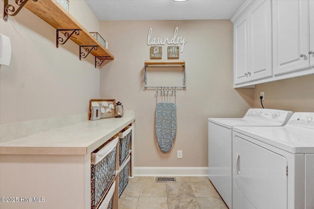 1171 Airport Rd, Pikeville, NC 27863 - clothes washing area featuring cabinet space, light tile patterned flooring, baseboards, and washer and dryer